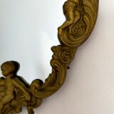 Gilded bronze mirror with angels and scrolls