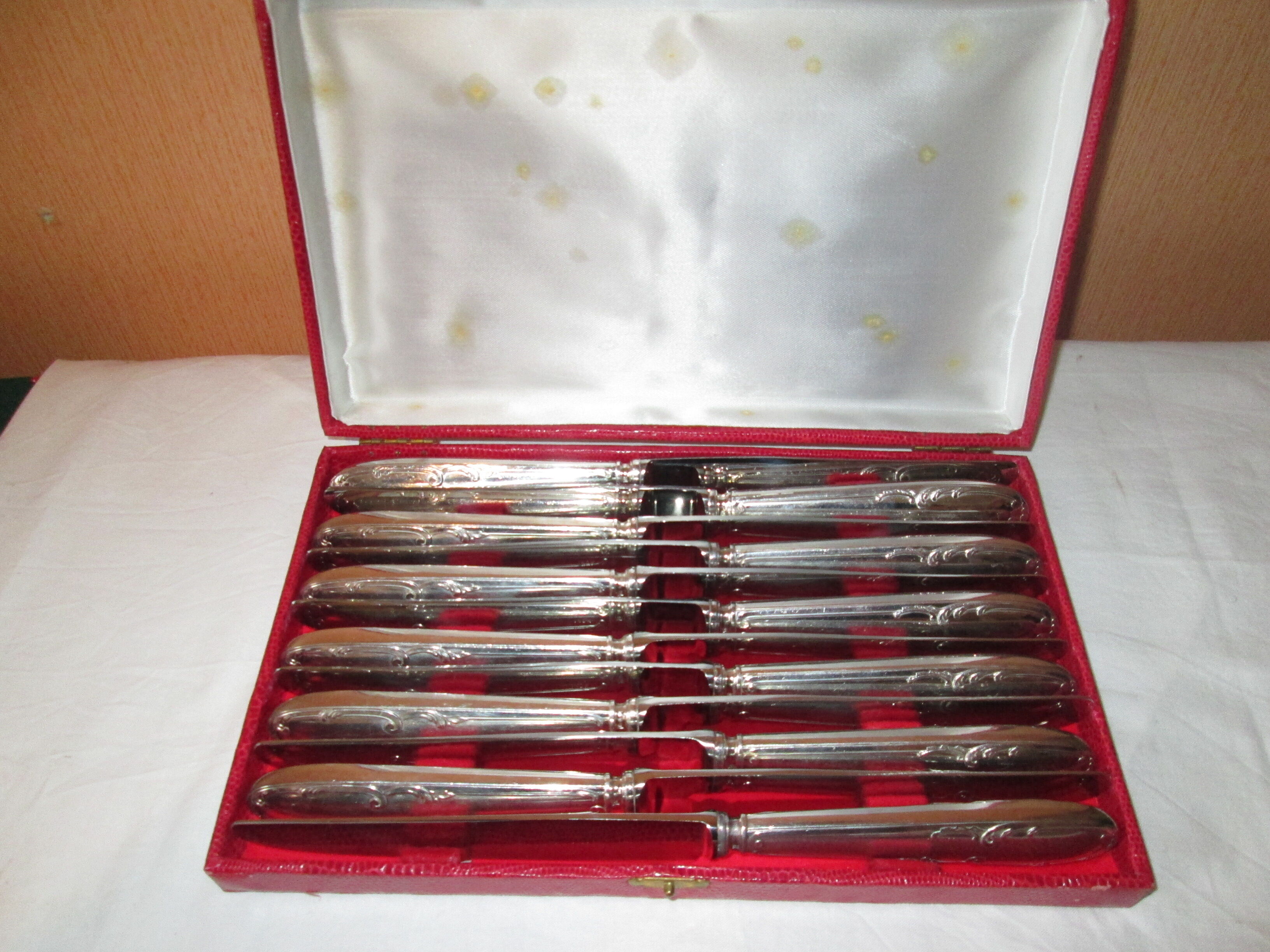 12 silver metal knives