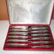 12 silver metal knives