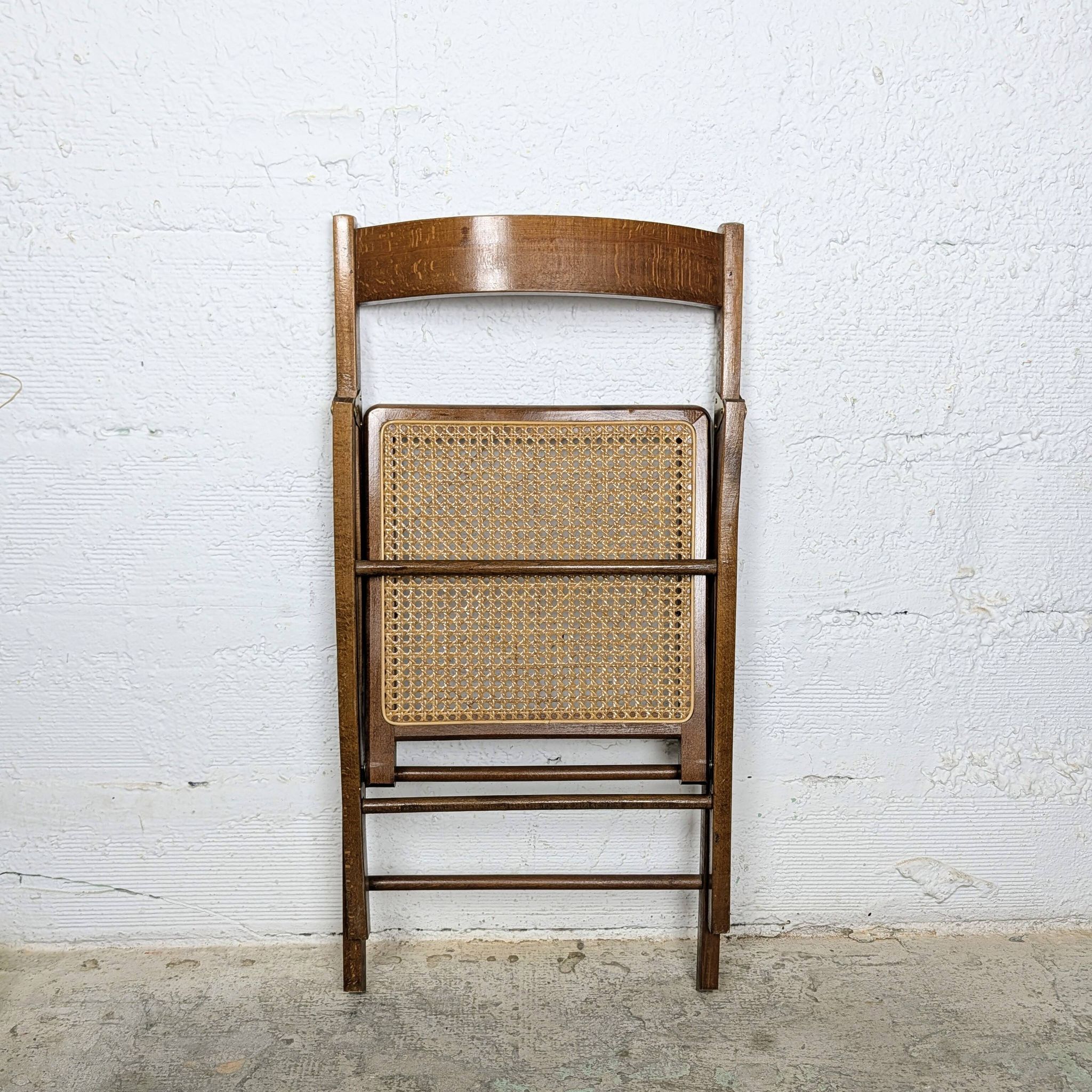 Folding chair with a cane seat