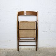 Folding chair with a cane seat