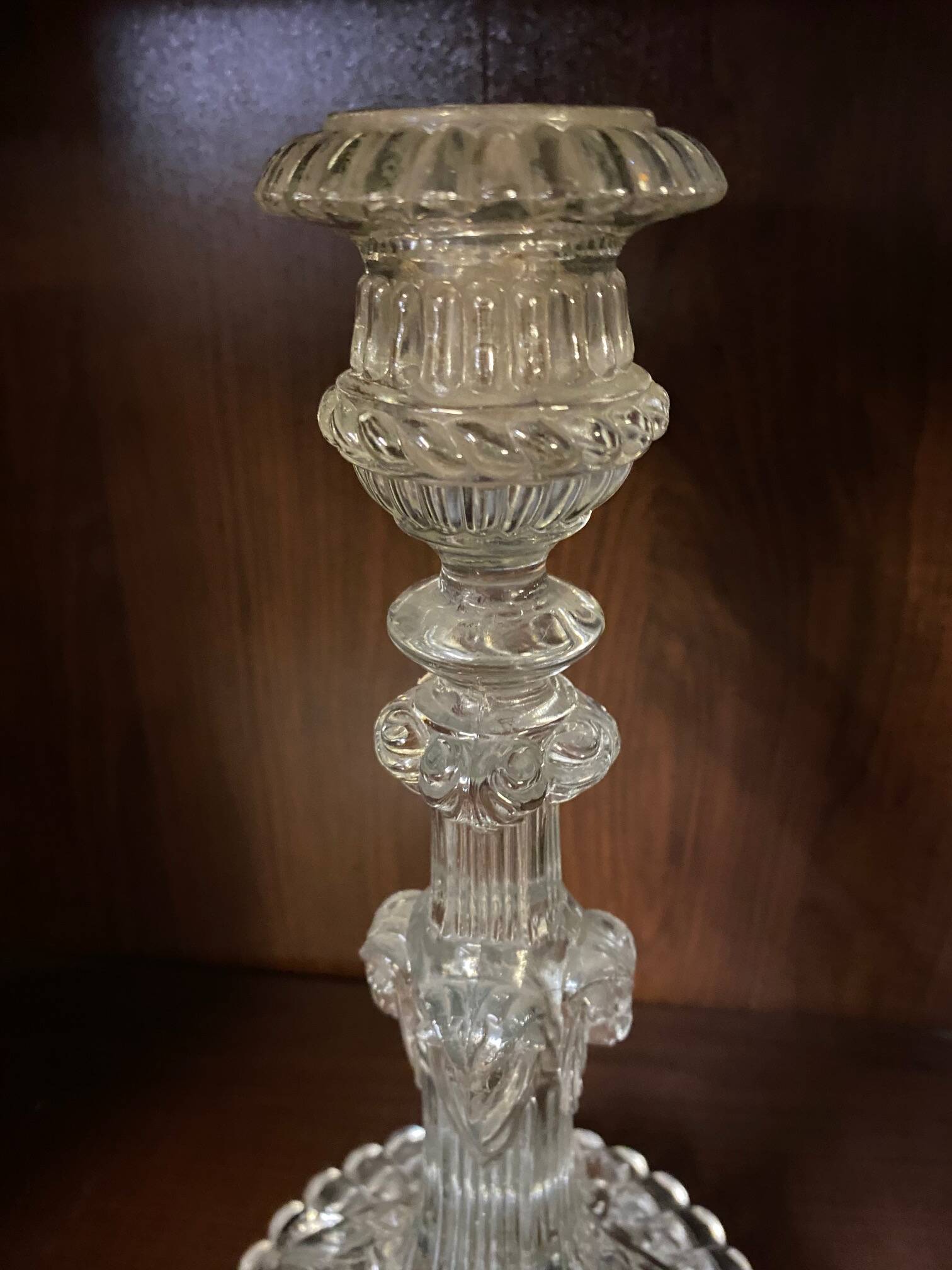 pair of cut glass candlesticks with lion and ram head decor, late 19th century