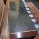 Bureau plat de style Empire en acajou et cuir vert
