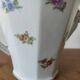 Antique porcelain sugar bowl with a decagonal base.