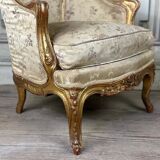 A Louis XV style child's bergère chair in carved and gilded wood, circa 1880