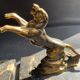Pair of art deco marble and patinated regulated bookends