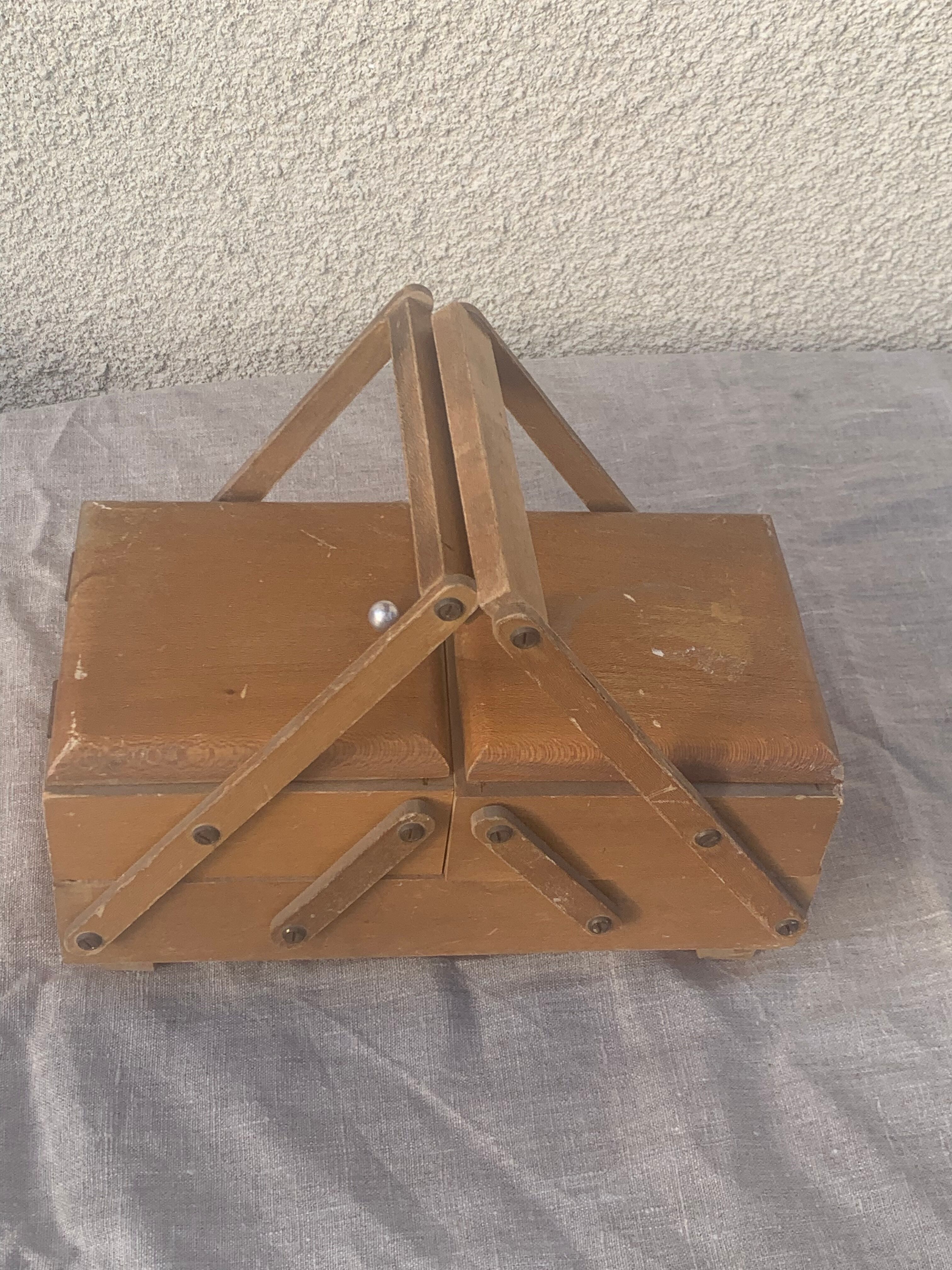 Sewing box in old varnished wood