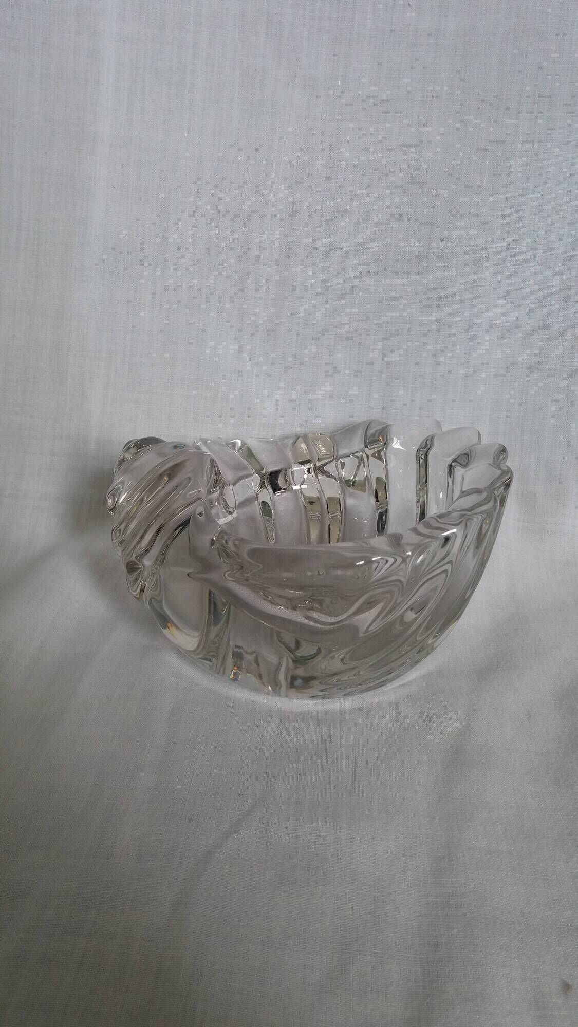 Shell-shaped crystal paperweight.