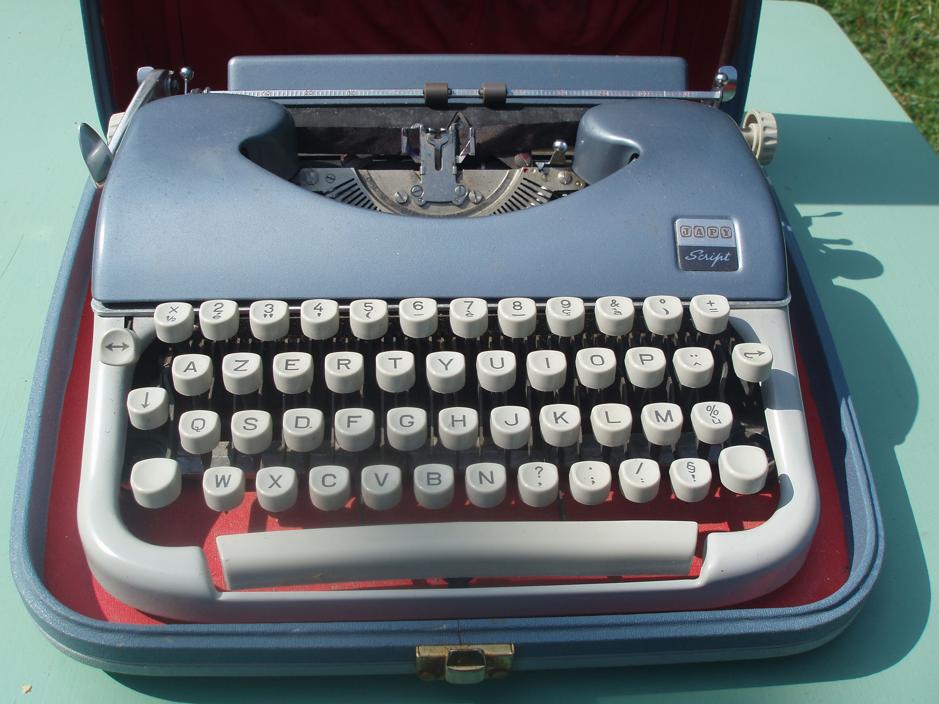 Typewriter blue japy script  with manual and carrying case