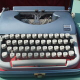 Typewriter blue japy script  with manual and carrying case