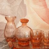 Pink glass liquor service and its accessories from the 1950s