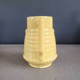 Yellow milk jug with reliefs