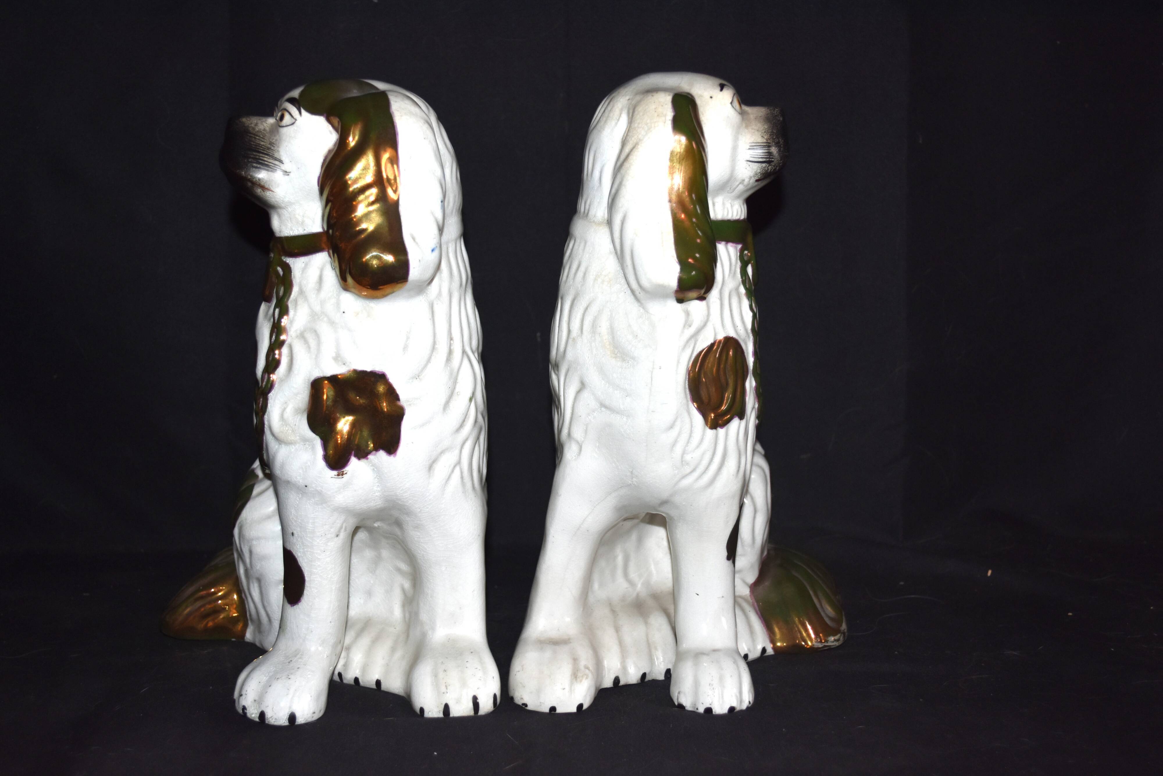 Pair of earthenware dogs (cavalier king charles)