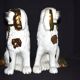 Pair of earthenware dogs (cavalier king charles)