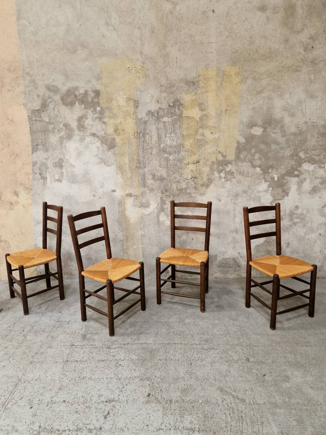 4 wooden and straw chairs