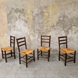 4 wooden and straw chairs