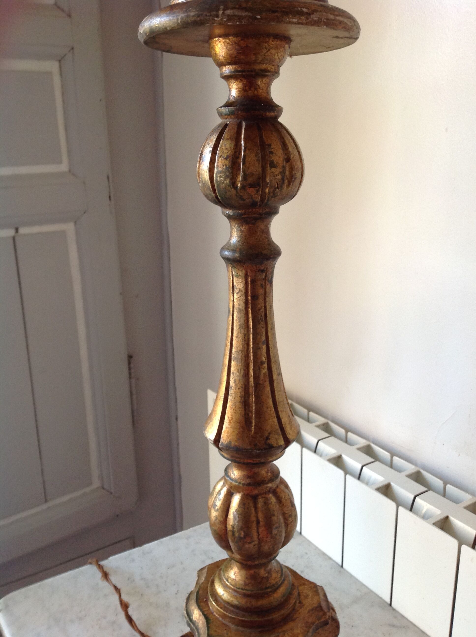 Old chandelier in gilded wood