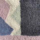 Hand-knotted wool rug by Tisca with a geometric pattern, signed "ILES", France, 1990s.