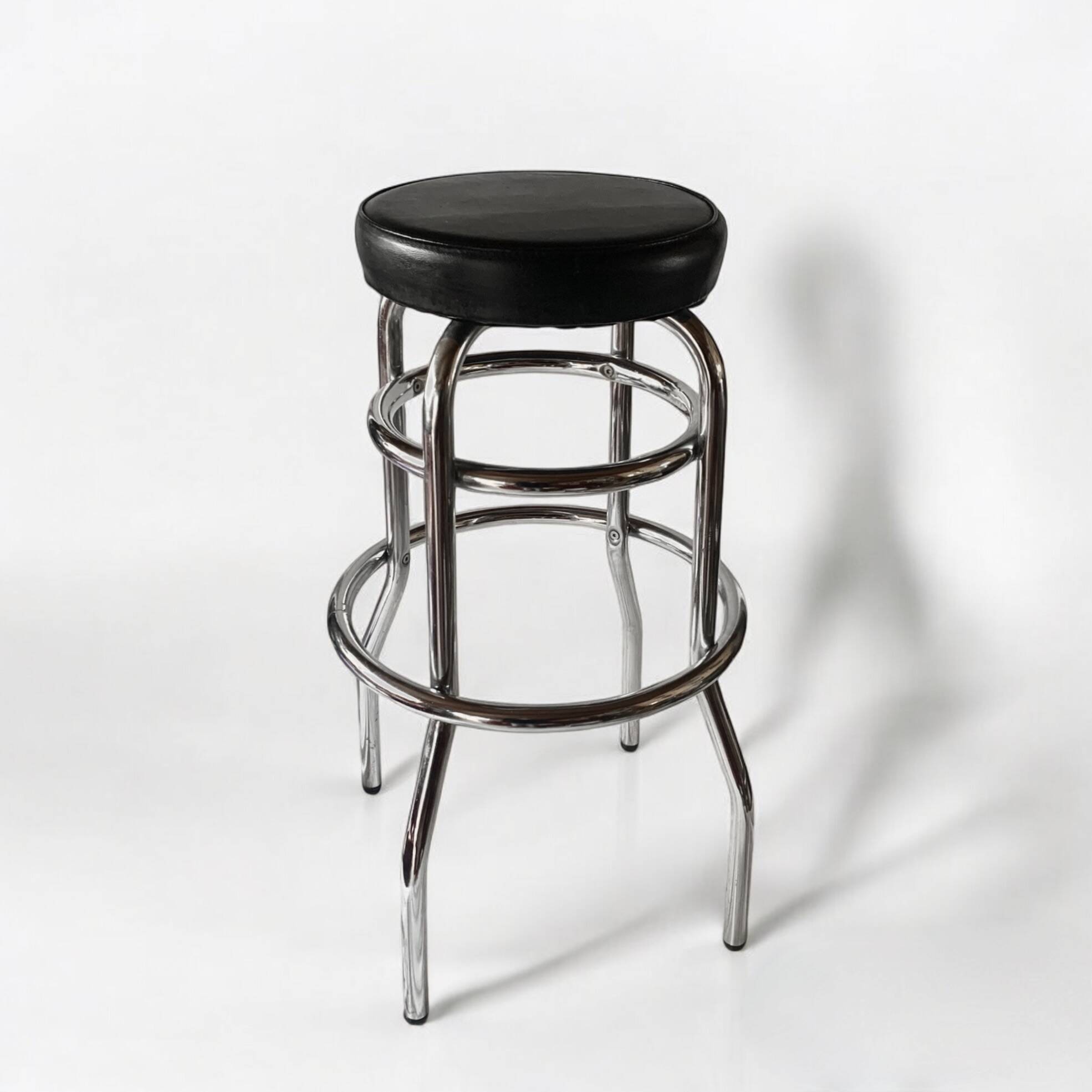 Vintage bar stool in black skai and chrome metal