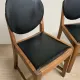Set of four vintage wooden dining chairs with black leather upholstery, 85 × 45 × 45 cm