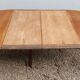 Table ovale 6 pieds avec allonges patine caramel