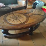 Ceramic and wood table in the shape of trees in the style of capron style