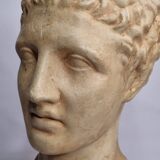 Bust of Hermes in patinated plaster on brown marble base, 34 cm