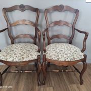 Pair of Provençal armchairs in brown wood and floral fabric.
