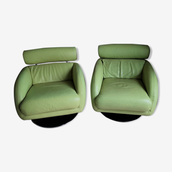 Pivitant leather armchairs