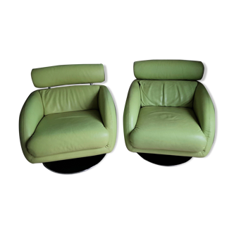 Pivitant leather armchairs