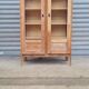 Armoire pied compas en chêne blond
