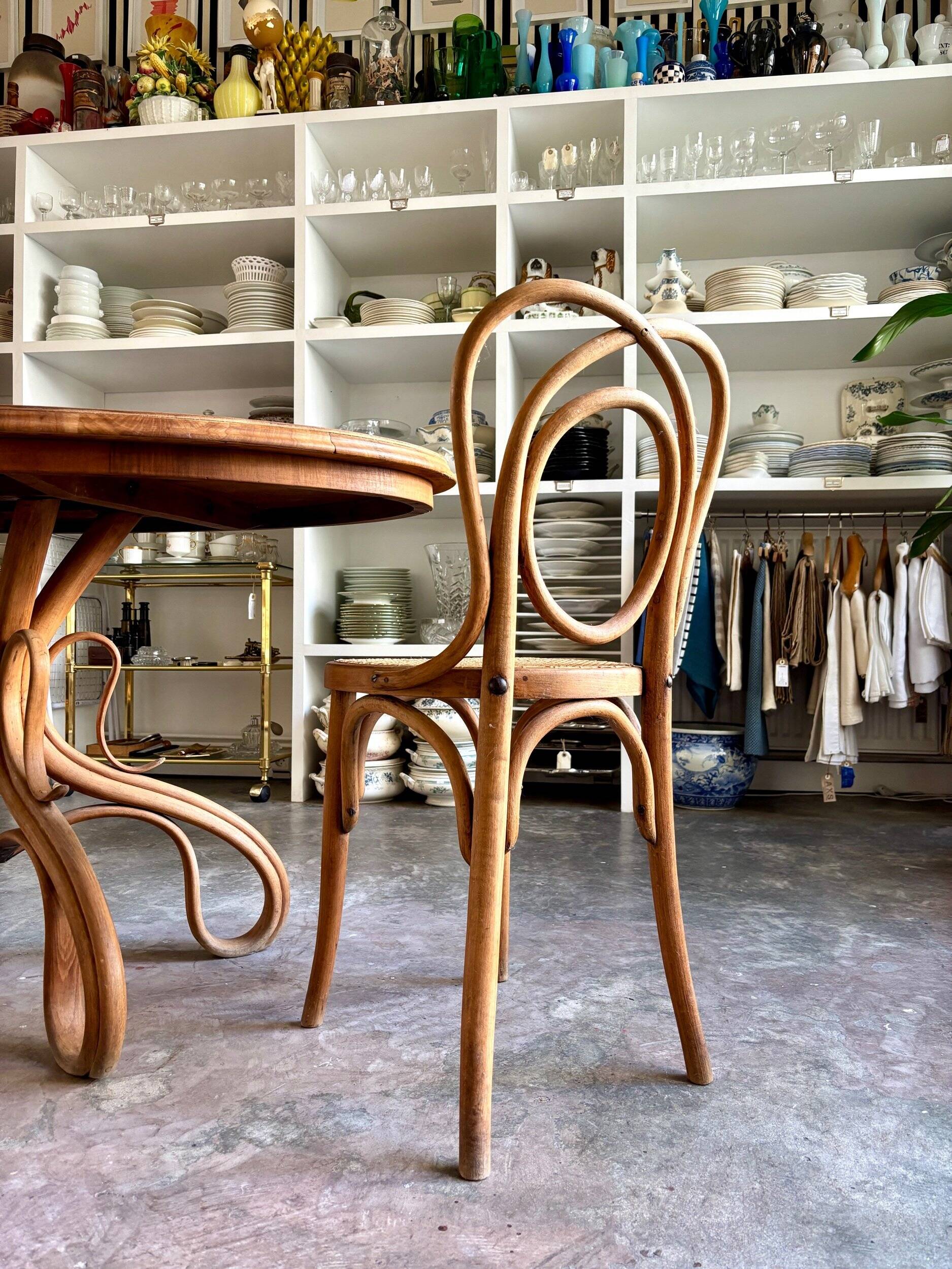 Thonet table no. 3 and 4 bent beech chairs with caning, circa 1890.
