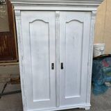 Vintage two-door wardrobe in painted white wood — late 19th century Hungarian style.