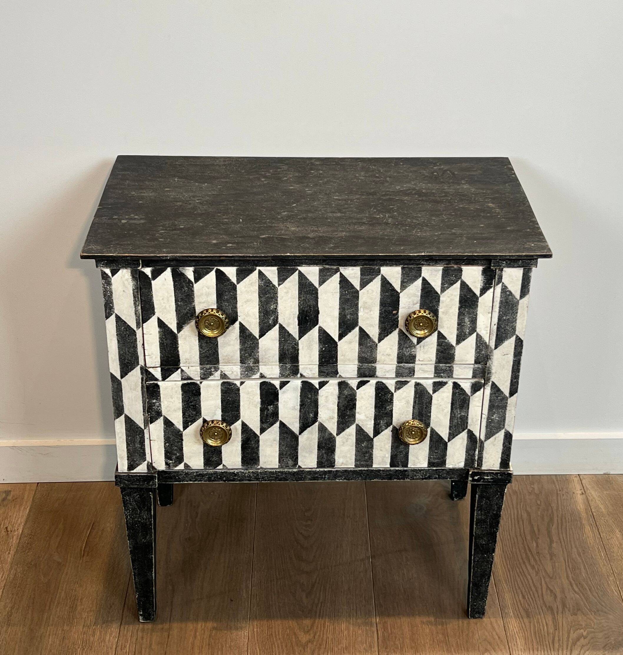 Small Italian chest of drawers with two drawers, patinated with a trompe-l'œil checkerboard pattern