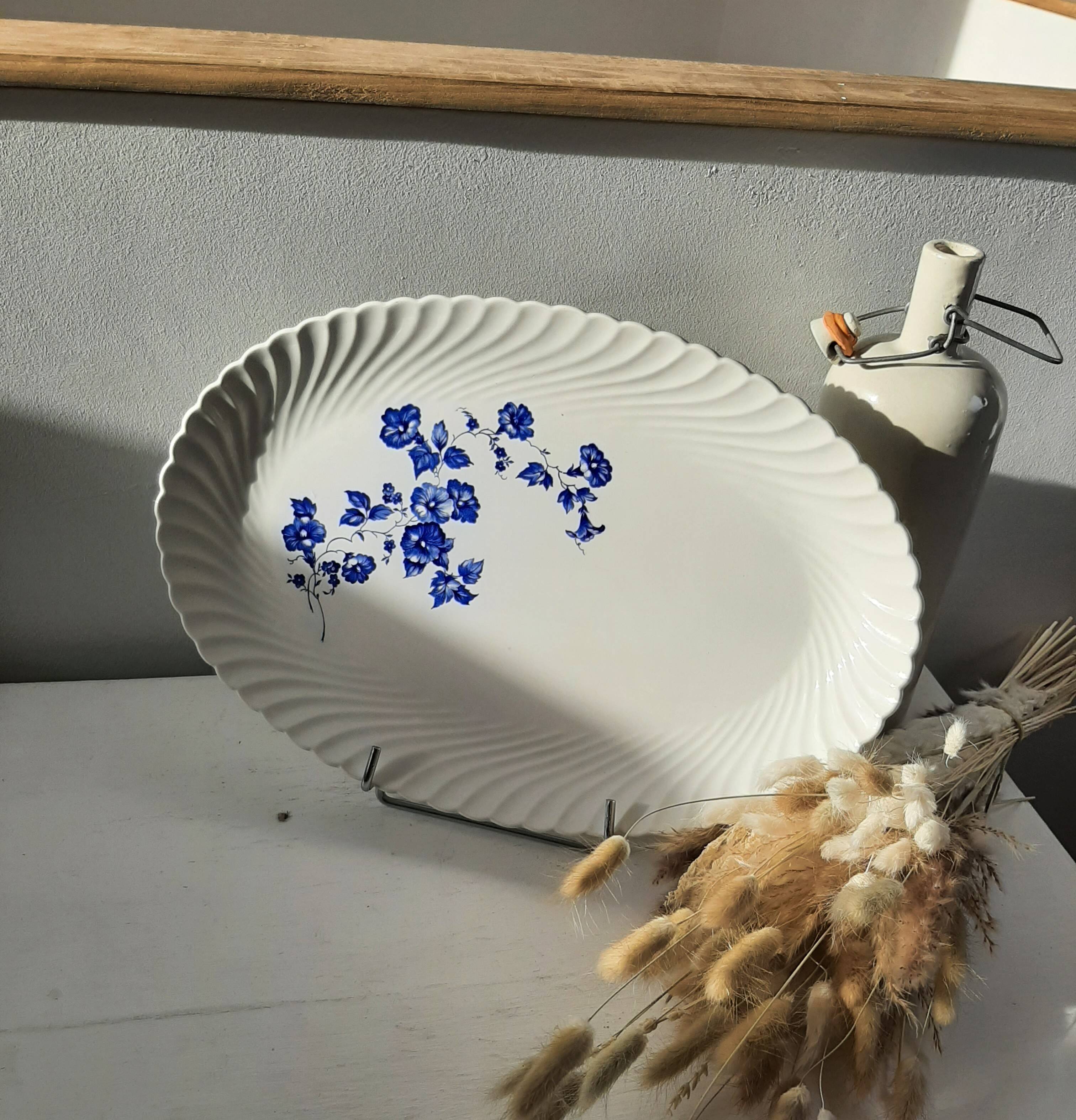Keller and Guérin Lunéville serving dish with blue flowers on a white background.