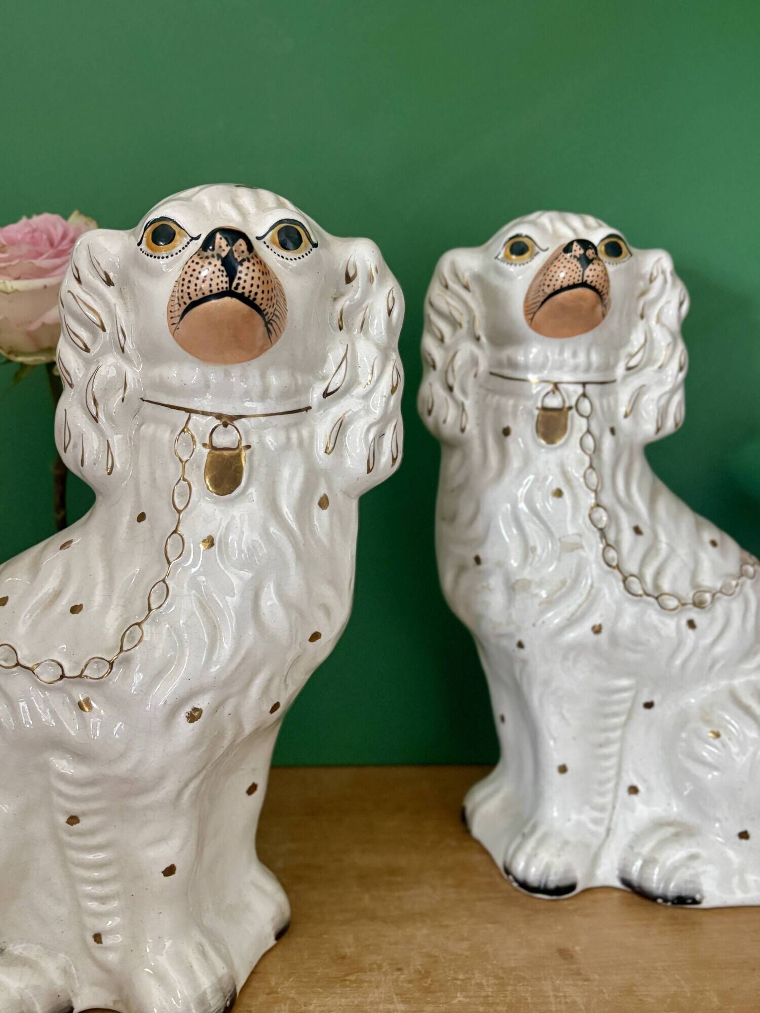 Pair of Staffordshire-type dogs in white and gold ceramic