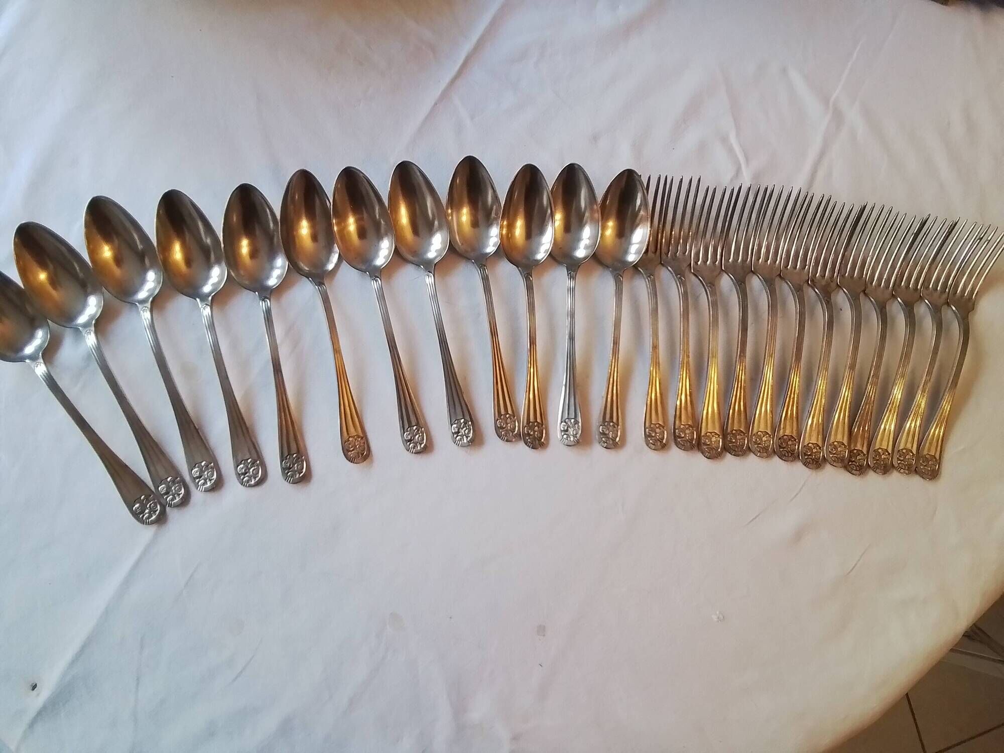 12 Art Deco forks and 12 Bouillet Bourdelle soup spoons.