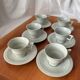 Art Deco cups and saucers by Théodore Haviland in celadon.