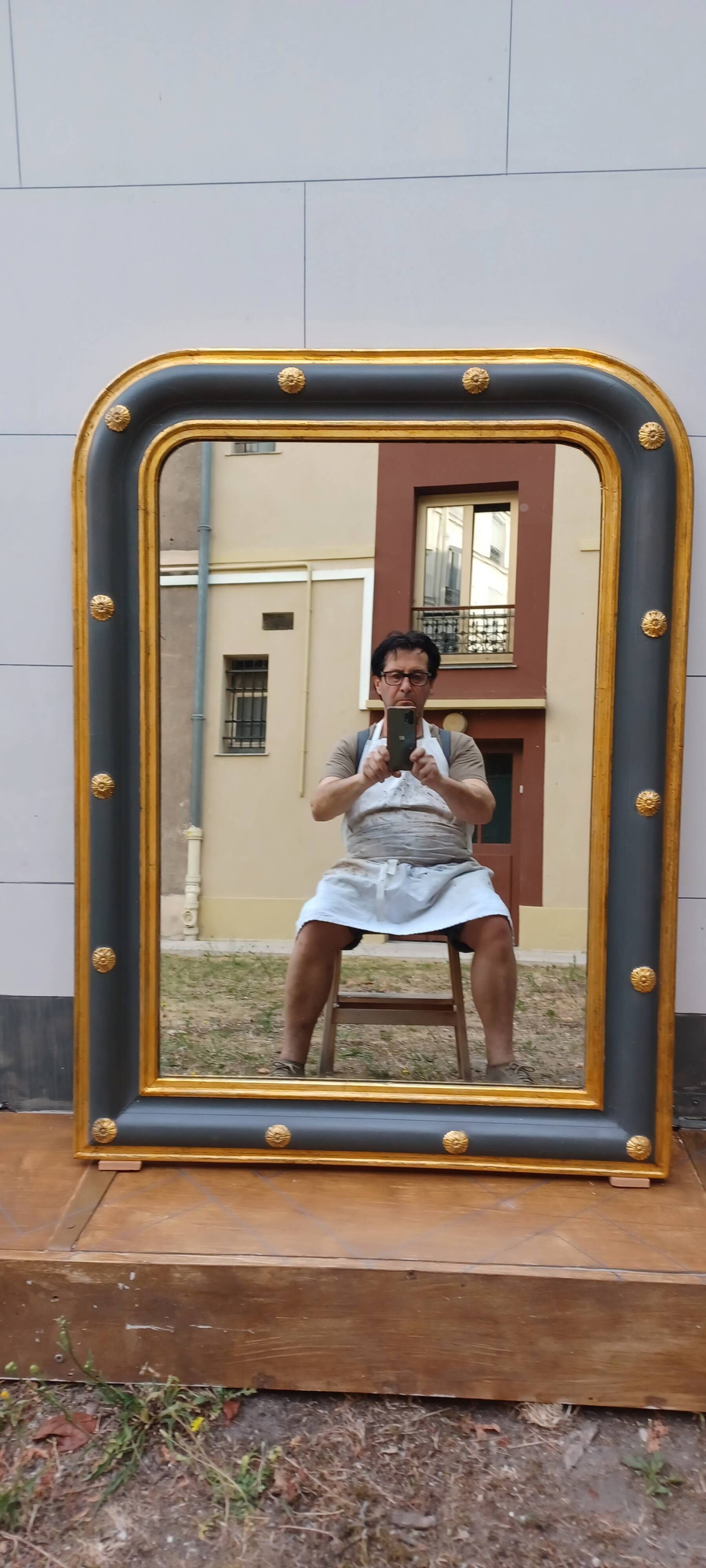 Louis-philippe grey and gilt mirror decorated in the antique style