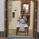Louis-philippe grey and gilt mirror decorated in the antique style