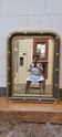 Louis-philippe grey and gilt mirror decorated in the antique style