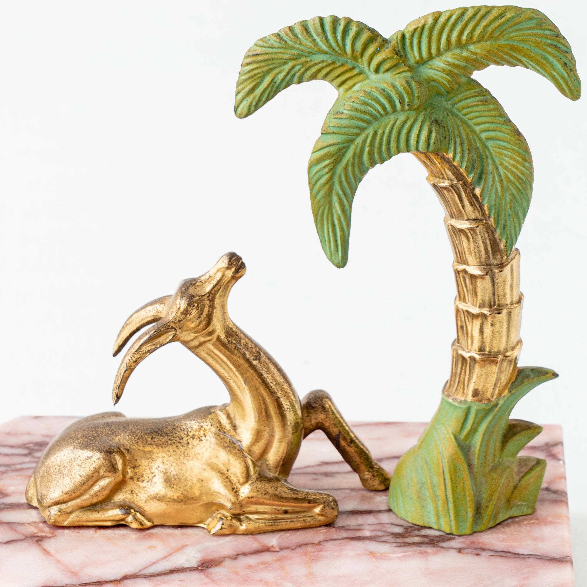 Pair of Art Deco Bookends in Pink Breccia Marble with Antelope and Palm Tree