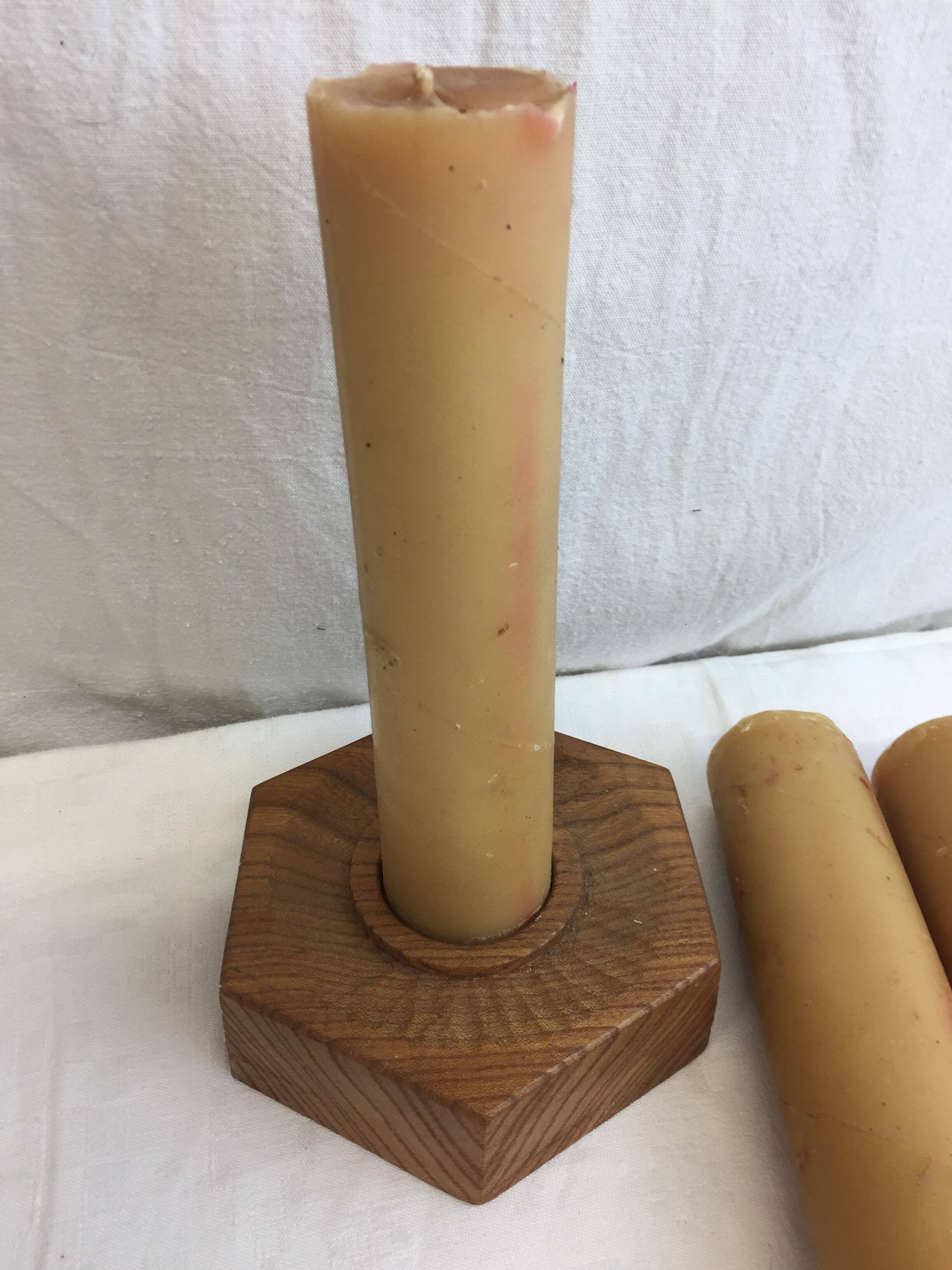 Handmade natural wood candle holder, hexagonal shape and its 3 old beeswax candles.