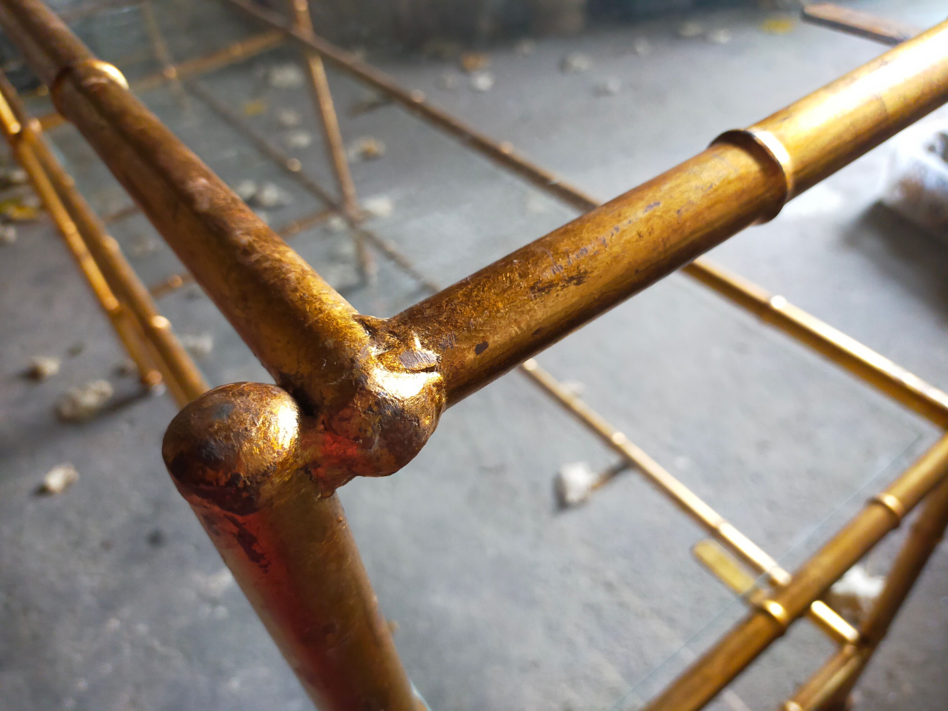 Console in gilded metal and glass