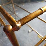 Console in gilded metal and glass