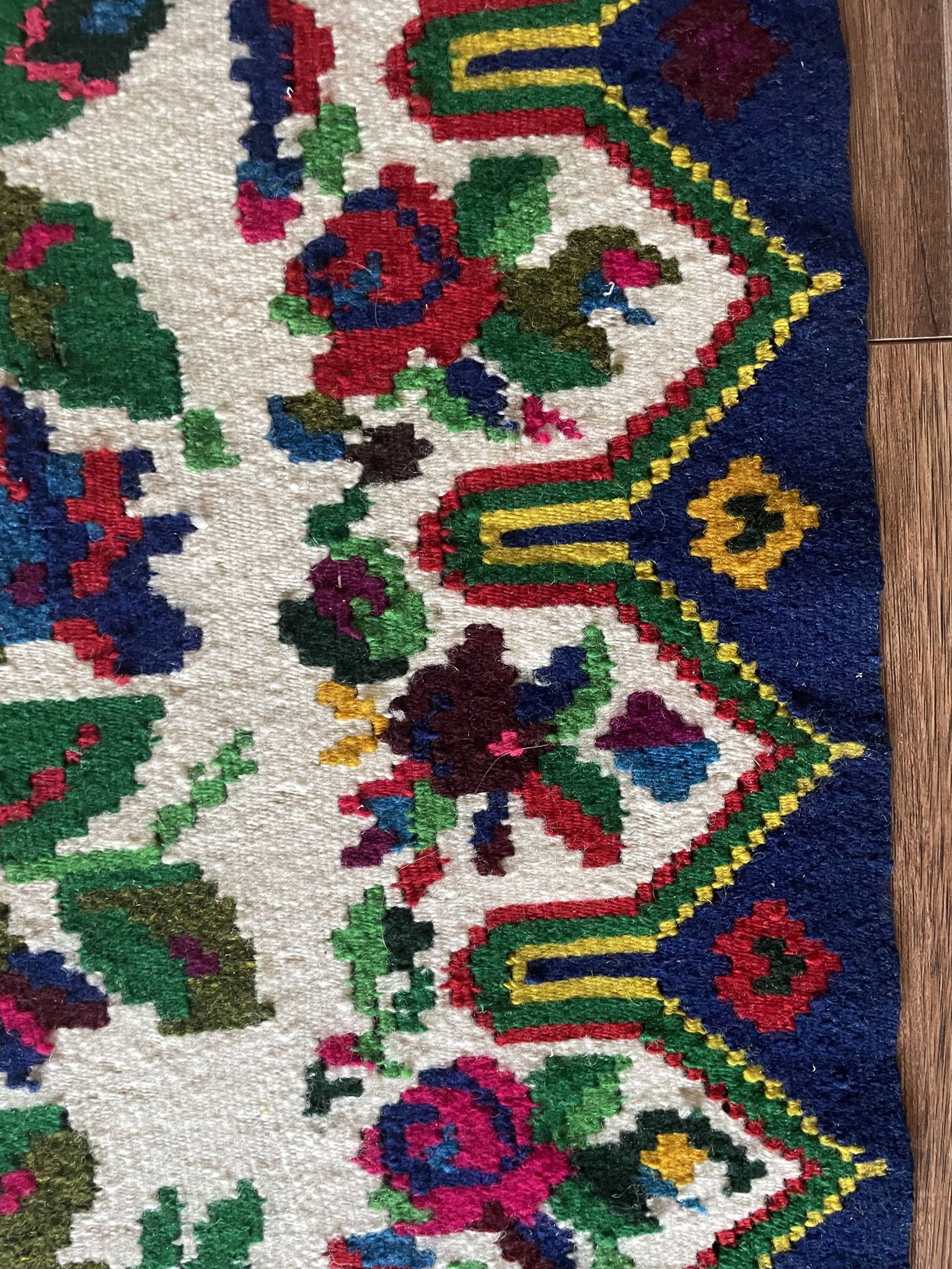 White vintage floral rug made by hand in Romania, beautiful flowers