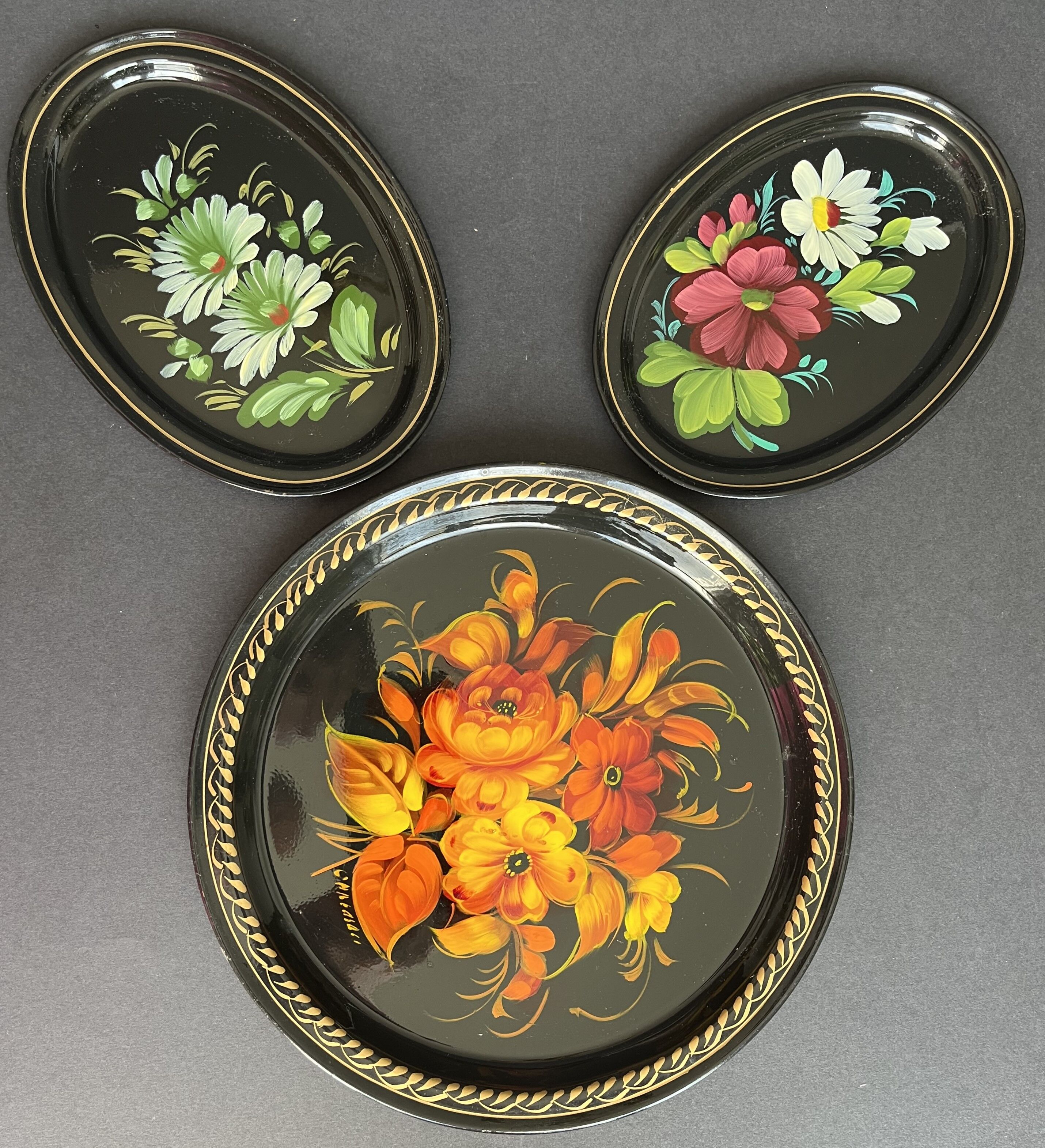 Set of three painted sheet metal trays