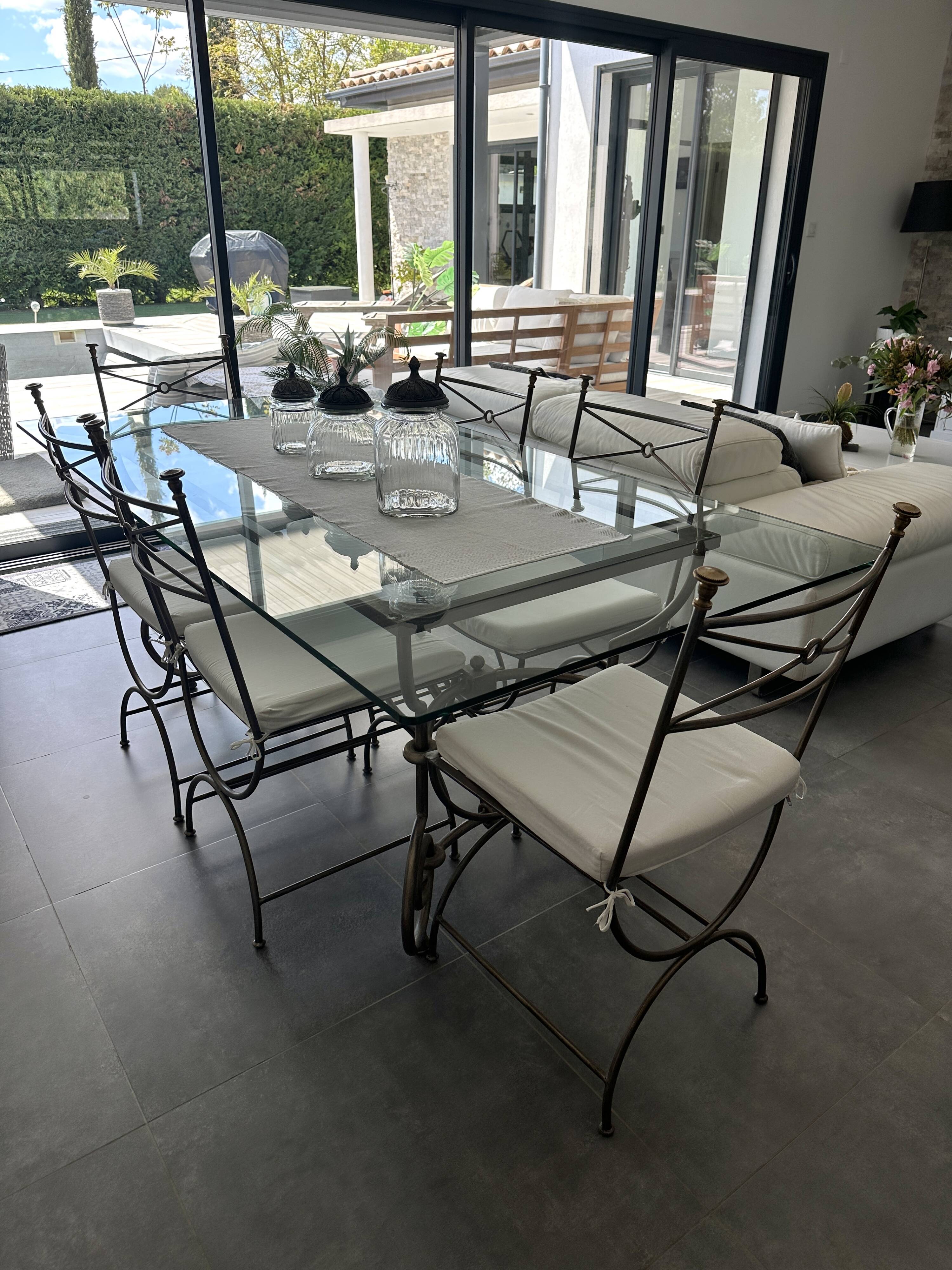 Roche Bobois glass and steel dining table and 6 chairs