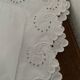 White cotton pillowcase with embroidery and monogram.