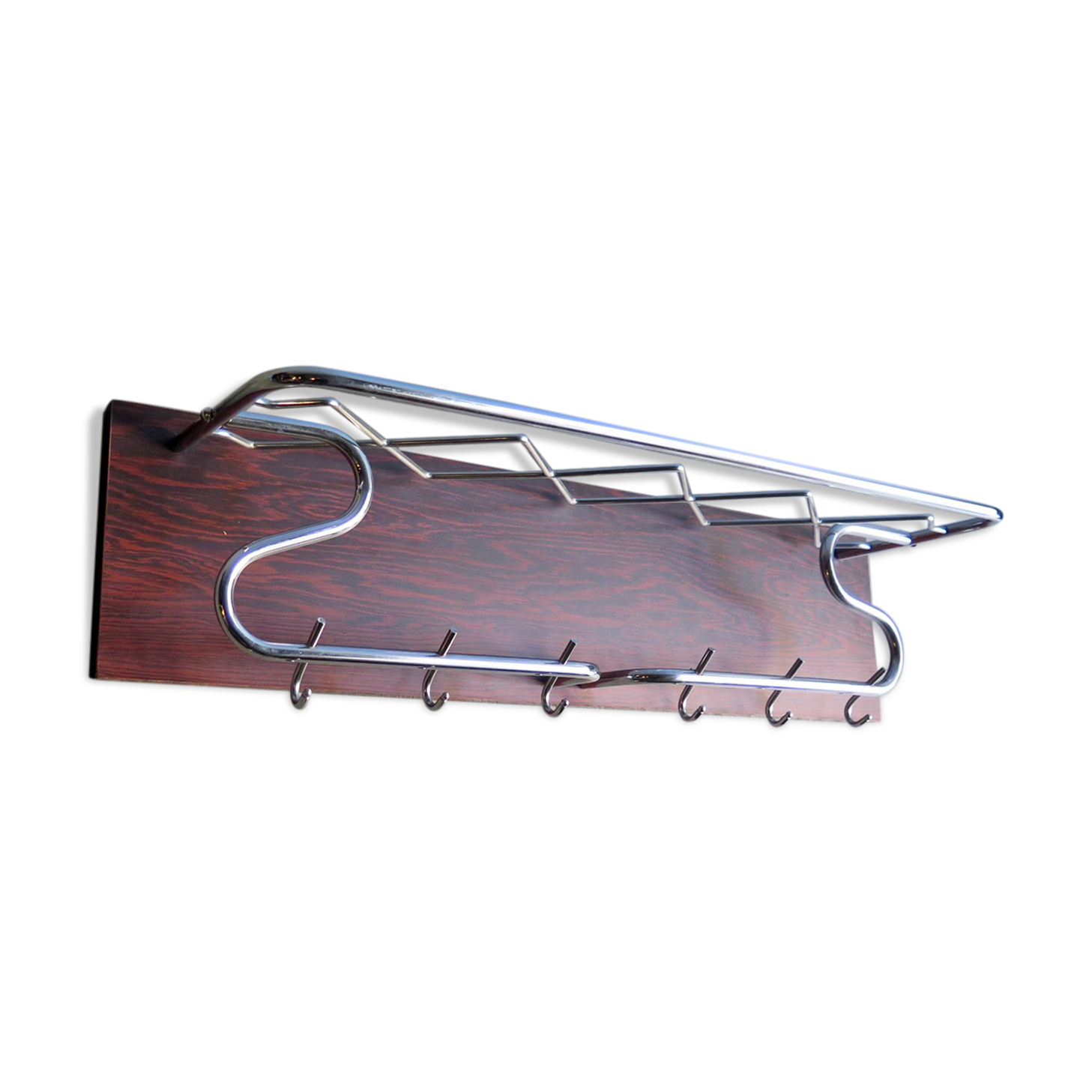 Chrome metal patere in a wooden support panel coat veneer.